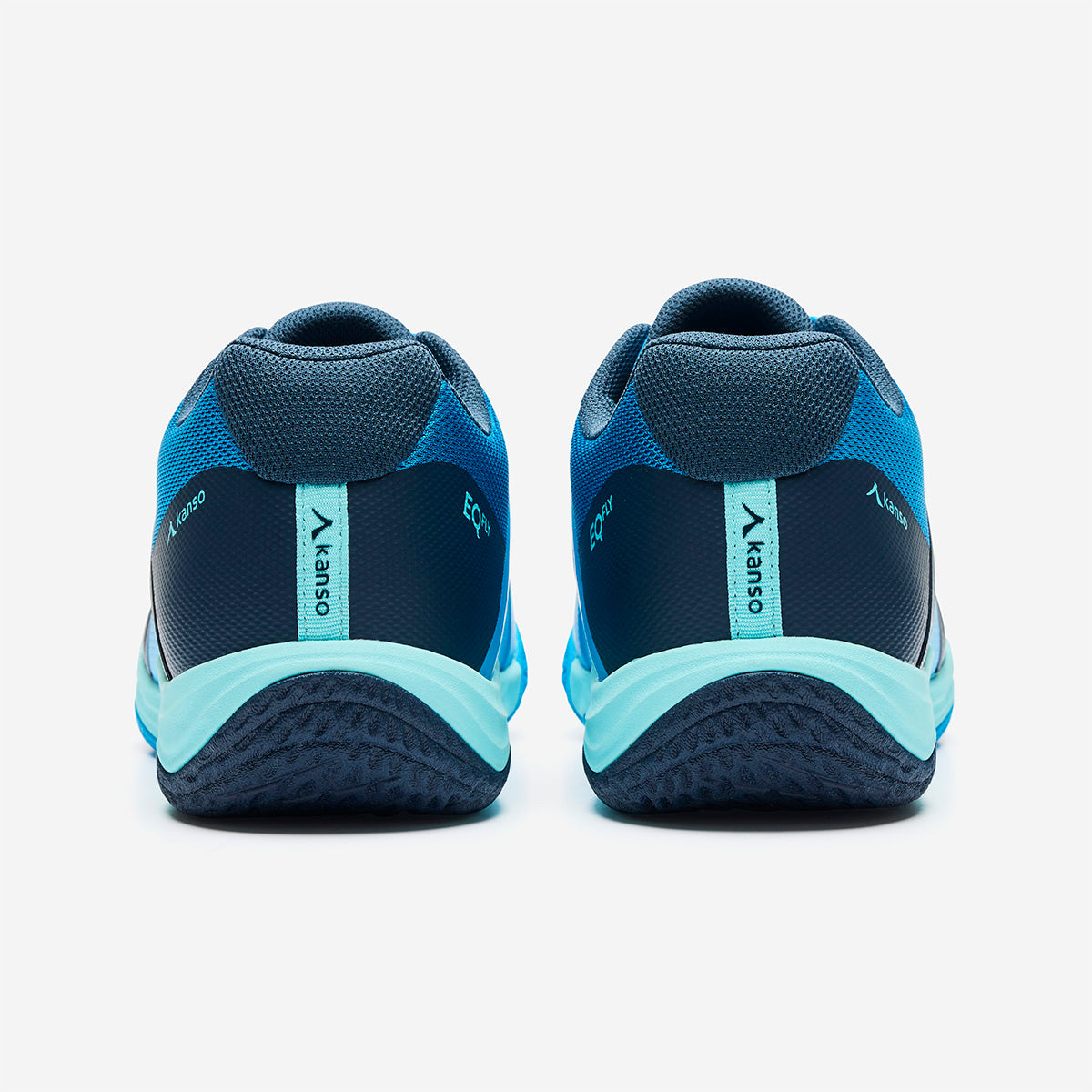 Blue and teal athletic shoes with visible brand logo on a white background