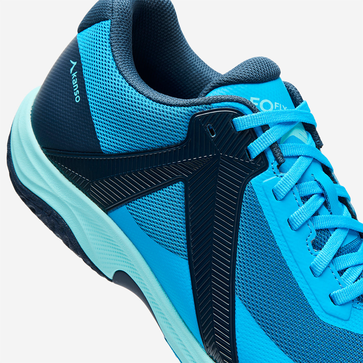 Blue and navy athletic shoe with brand logo on a white background